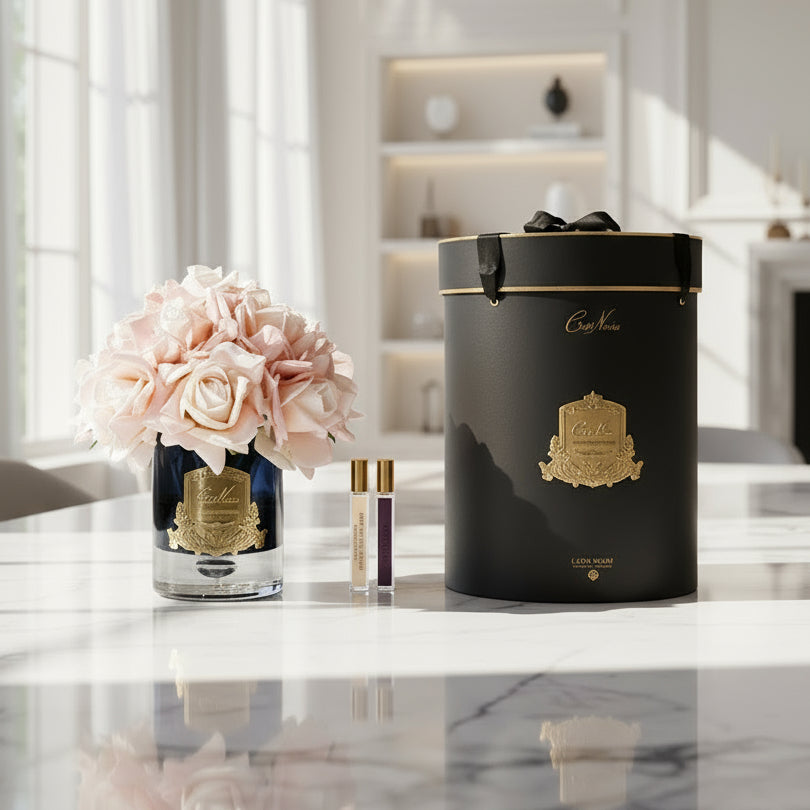 Cote Noire perfume set with flowers and black cylindrical hat box