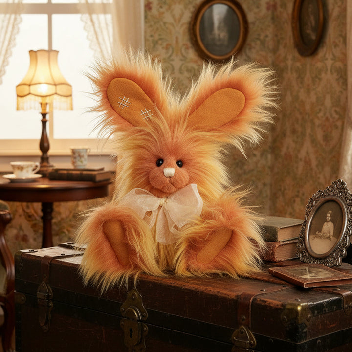 Plush charlie bears toy resembling a rabbit with a fluffy brown coat on a white background