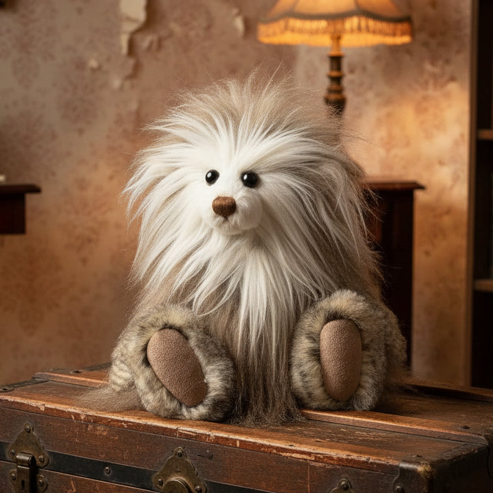 Plush toy resembling a creature with long fur on a white background