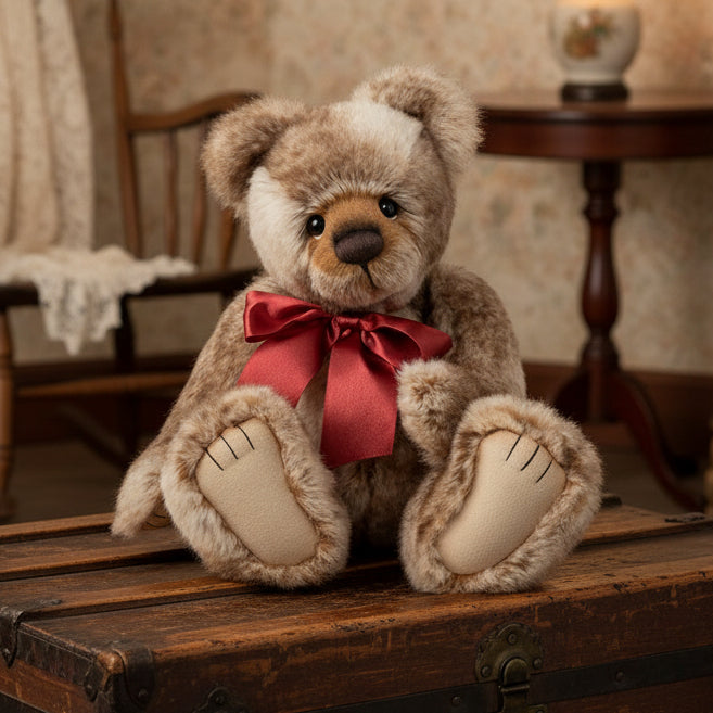 Stuffed charlie bears collectable teddy bear with a red bow on a white background