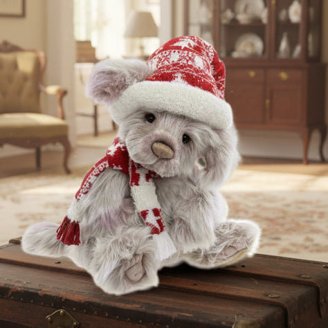 Charlie Bears plush toy wearing a red and white hat and scarf