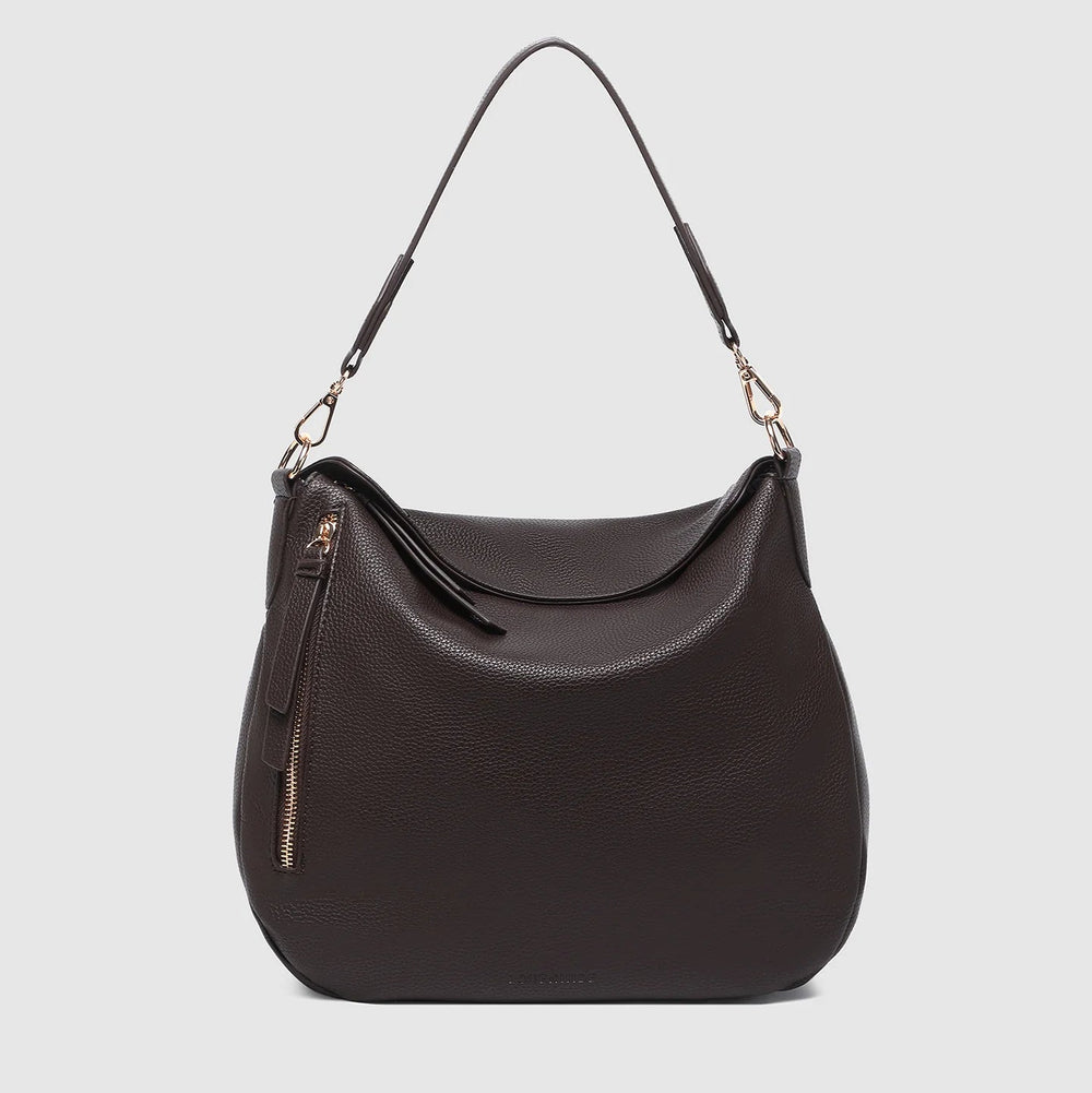 Black handbag with a shoulder strap on a light gray background