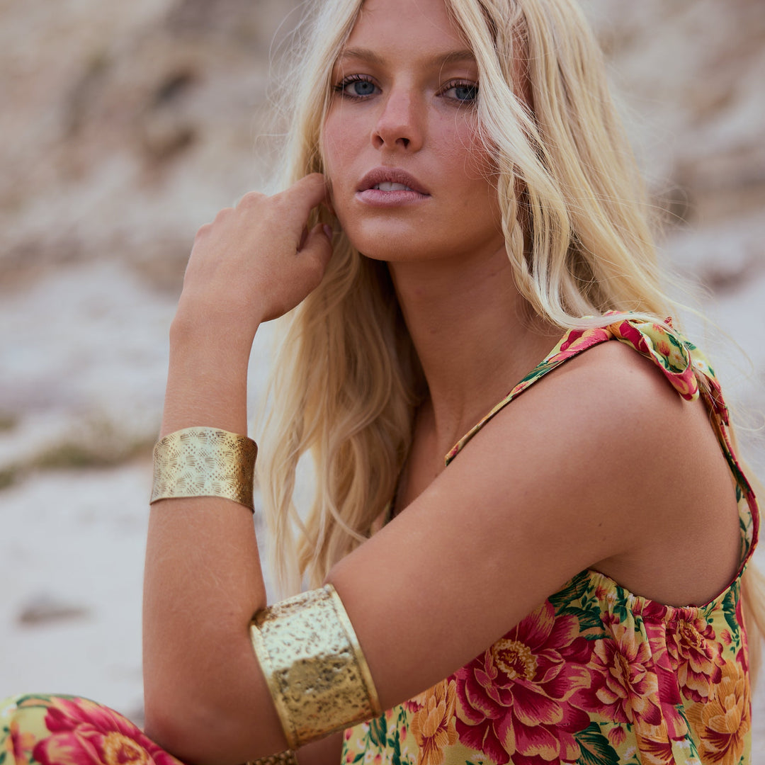 woman wearing a gold cuff