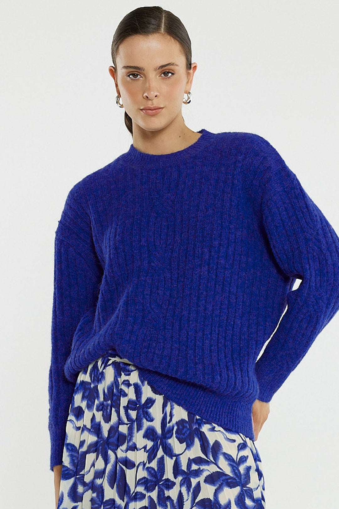 model wearing a satriking blue knit sweater 