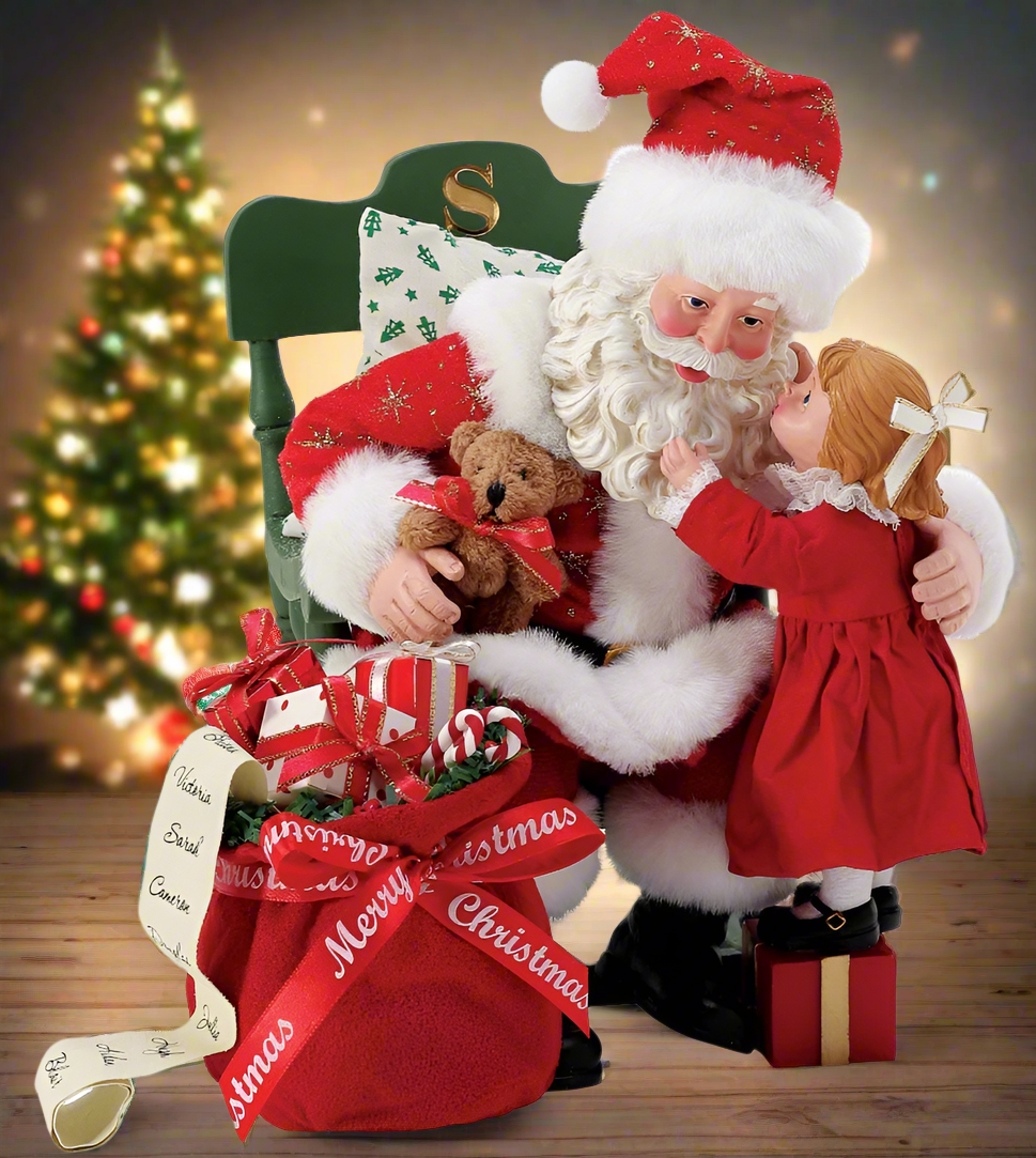 Decorative figure of Santa Claus with a child and teddy bear, sitting on a chair with Christmas decorations.