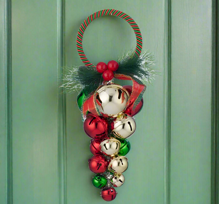 Decorative Christmas ornament with colorful jingle bells and ribbons on a white background