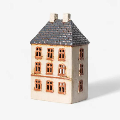 Ceramic model of a house with a gray roof on a white background