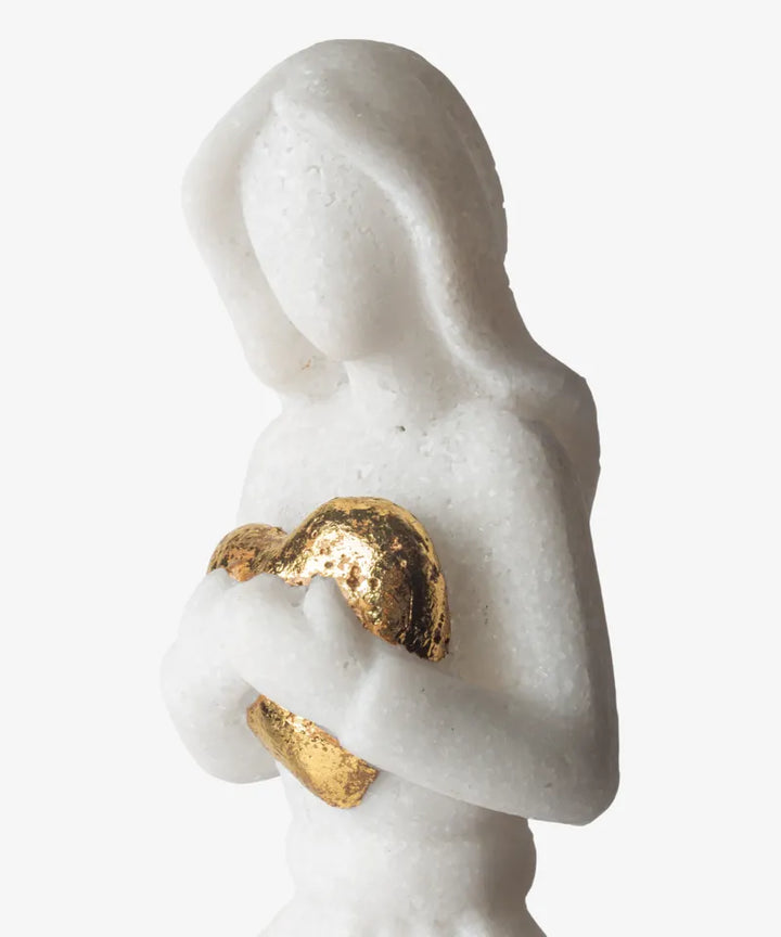 Marble statue with gold crescent moon and circle ring on a white background