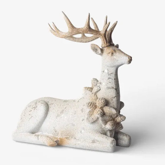 Decorative deer figurine with coral on a white background