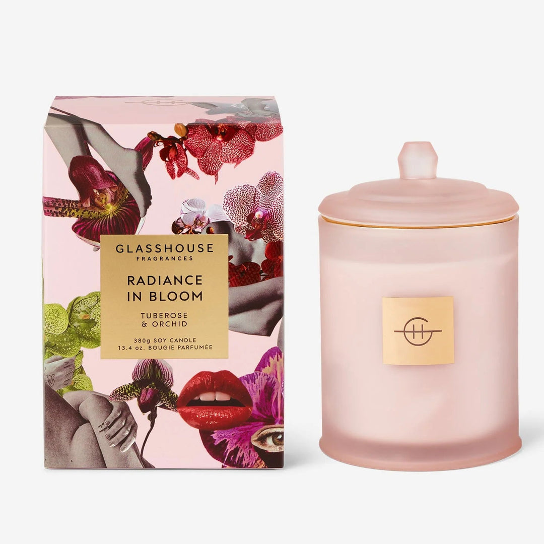 Pink candle with decorative packaging on a white background