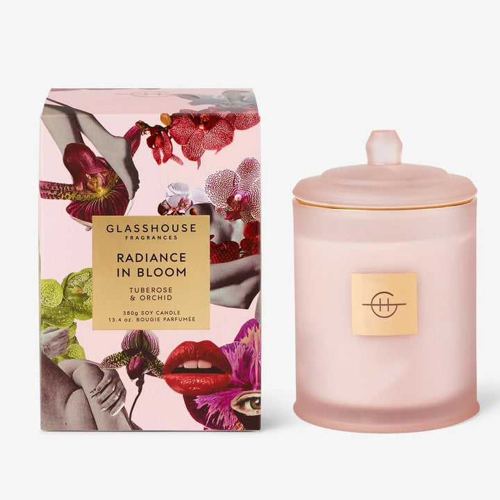 Pink candle with decorative packaging on a white background