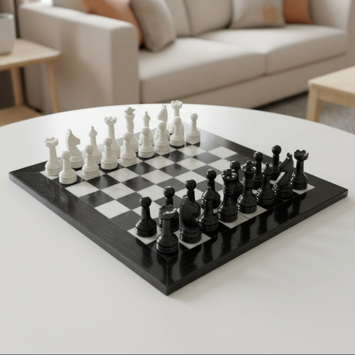 Black and white marble chess set on a checkered board
