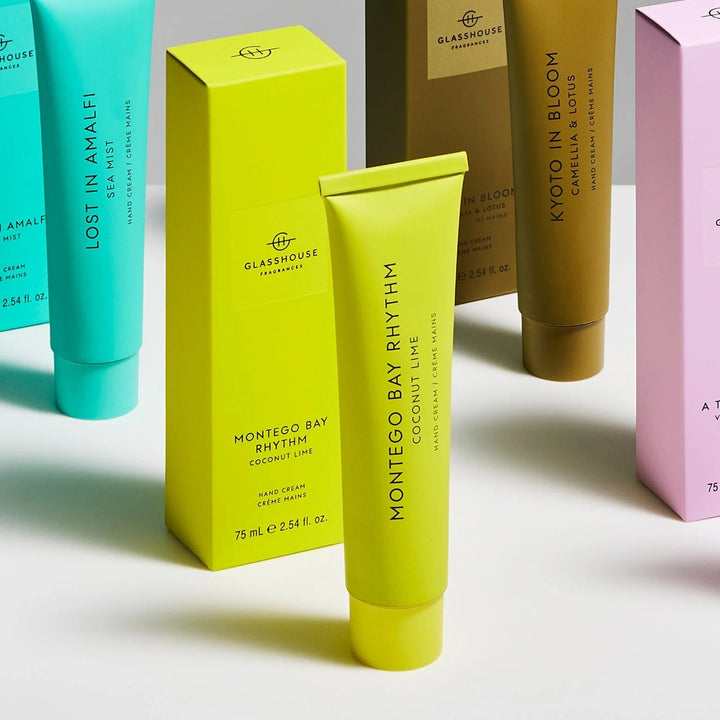 Collection of colorful skincare products and boxes on a light gray background