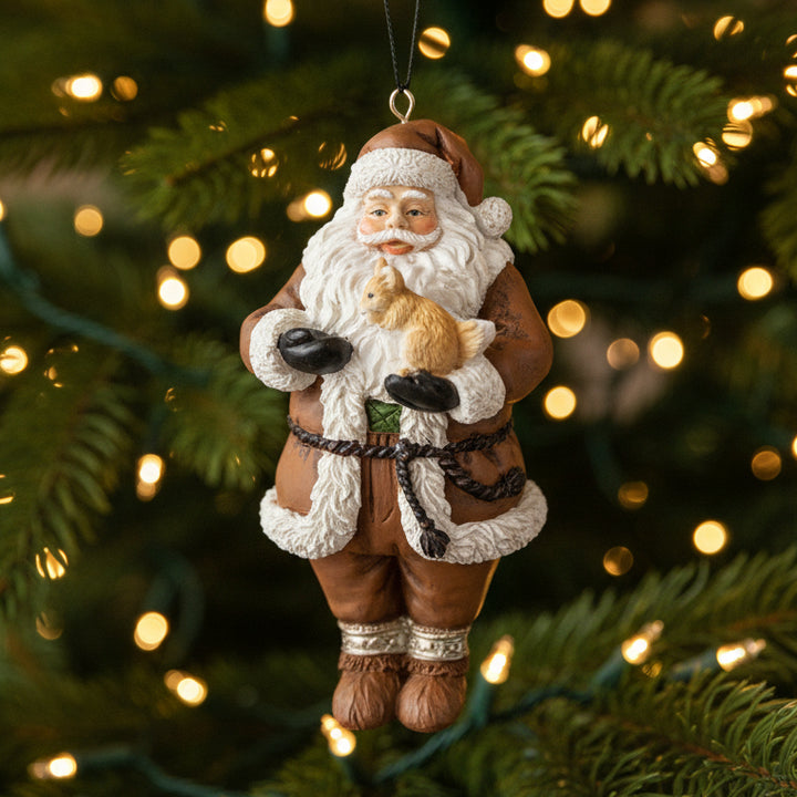 Decorative Christmas ornament of a Santa Claus figure with a reindeer on a white background