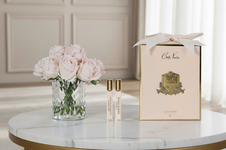 Cote Noire perfume set with champagne pink roses in a lxury room