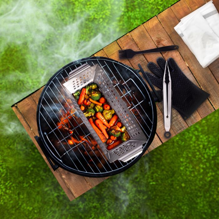 Barbecue grill with vegetables on a wooden deck