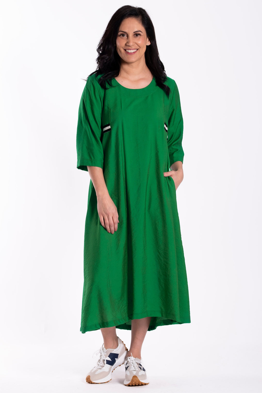 Woman wearing a green dress on a white background