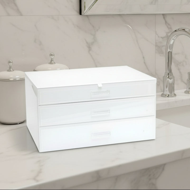 White glass jewelry box with a white lid and drawers