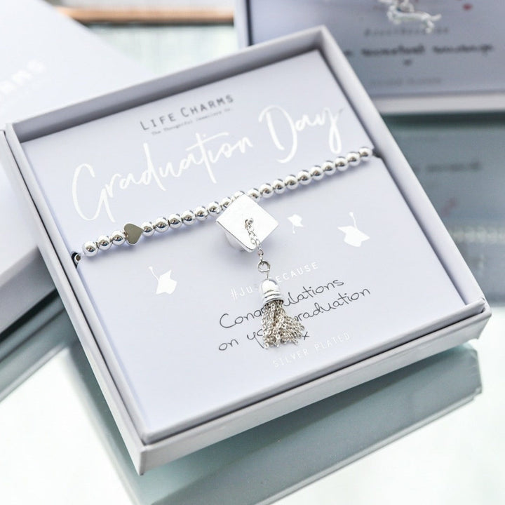 Graduation-themed bracelet in a decorative box with 'Graduation Day' text.