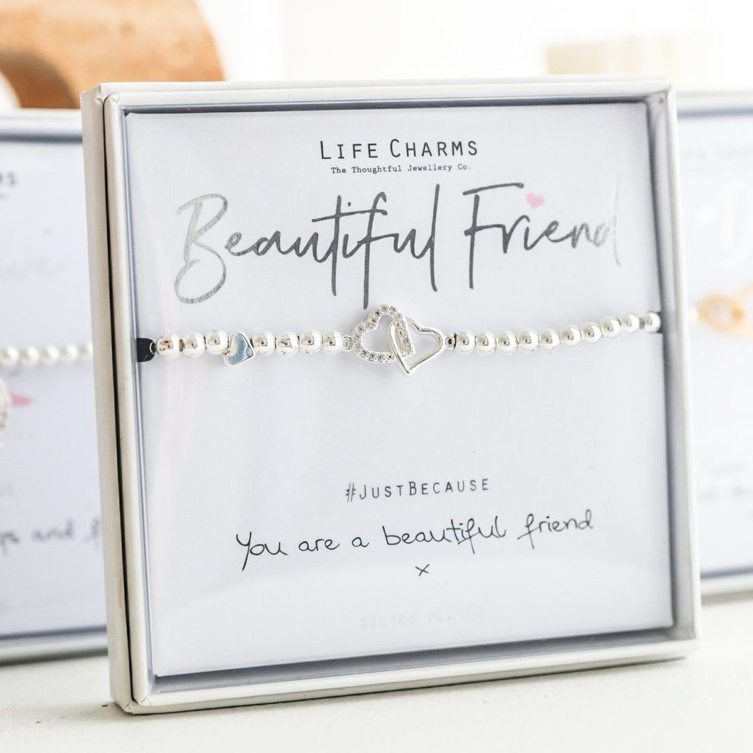 Bracelet with heart charm on a card labeled 'Beautiful Friend' by Life Charms.
