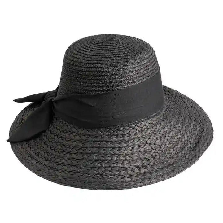 Black straw hat with a wide brim and black ribbon on a white background