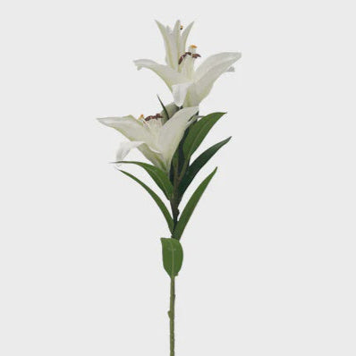 Artificial white lily flower on a gray background