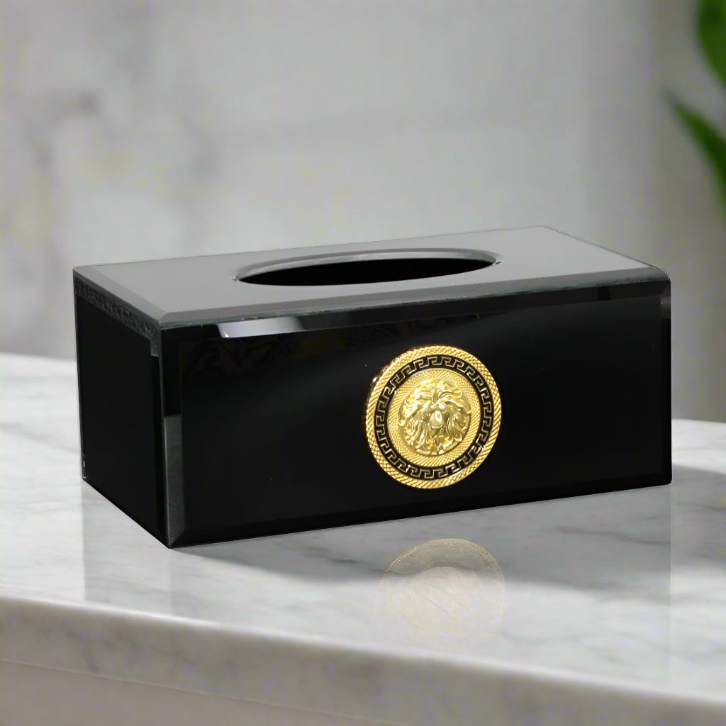 Black tissue box cover with gold emblem on a white background