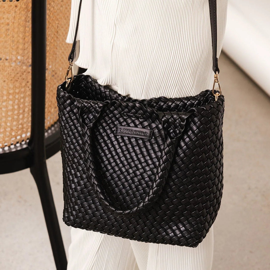 ladies legs with a louenhide baby tote bag