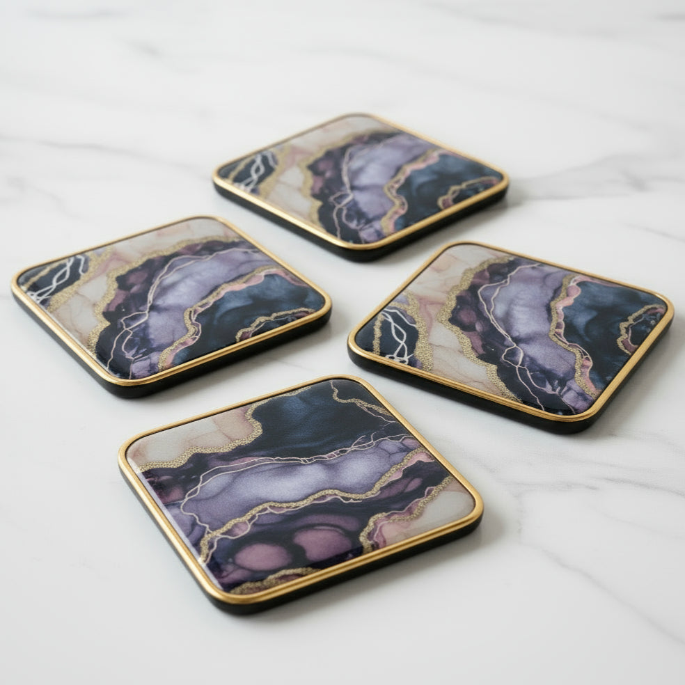 Decorative tin box holding 4 x marbled coasters 