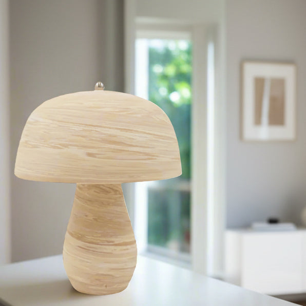 Mushroom-shaped lamp with woven design on a white background