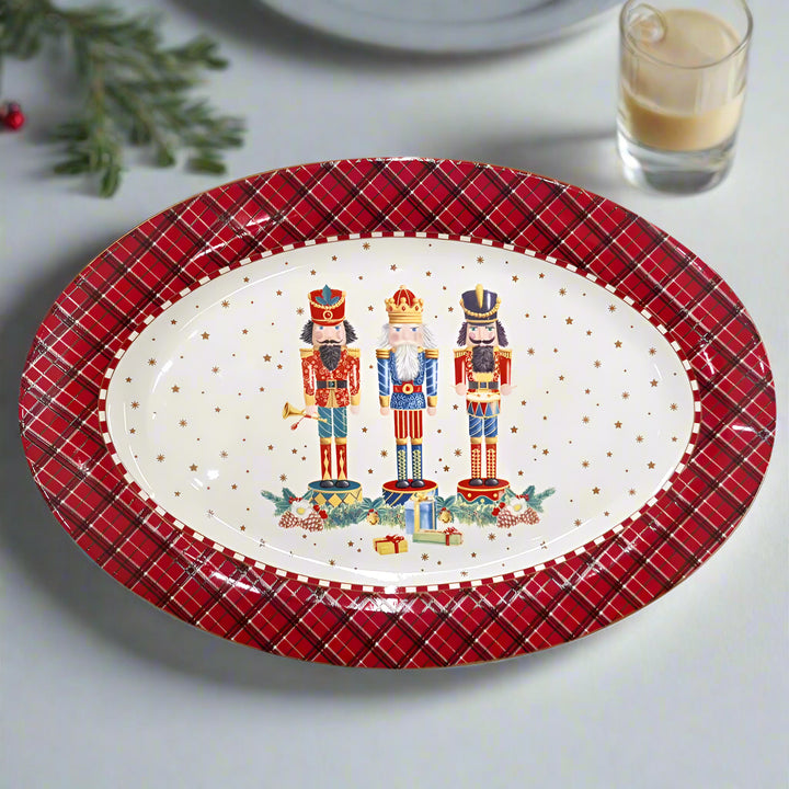 Decorative christmas plate with nutcrackers and plaid border on a white background