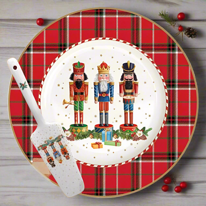 Christmas-themed plate with nutcrackers and plaid border, accompanied by a spatula.