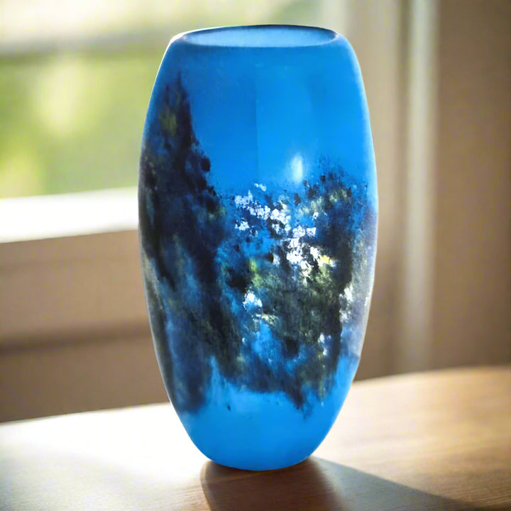 Blue glass vase on a white background