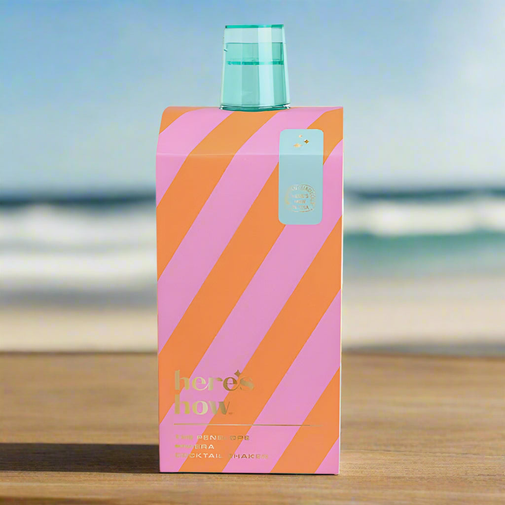 Colorful striped perfume bottle packaging on a light gray background