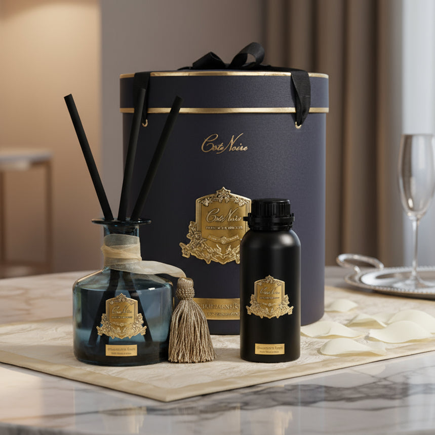 Cote Noire diffuser set with black and gold packaging on a white background