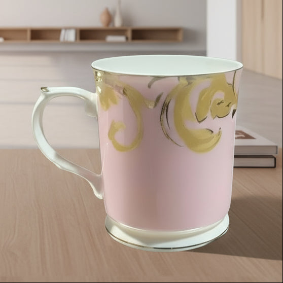 Pink mug with gold decorative patterns on a white background