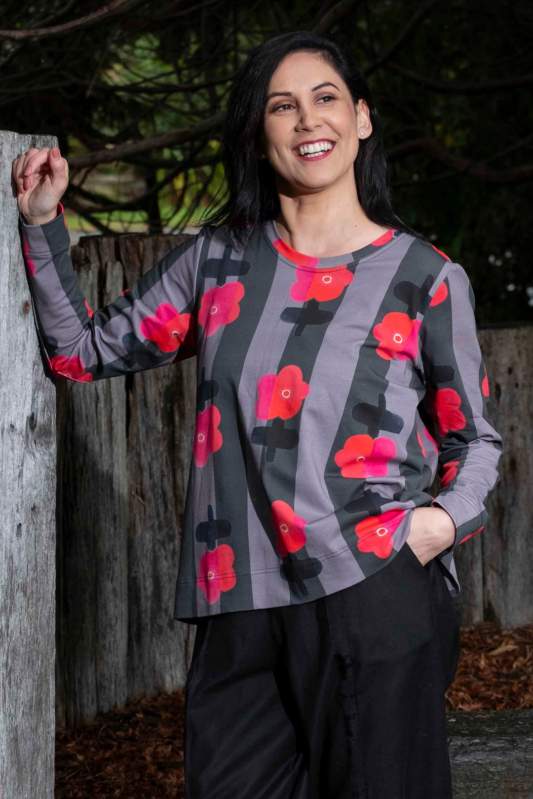 lady wearing bright fun sweatshirt in outdoor setting