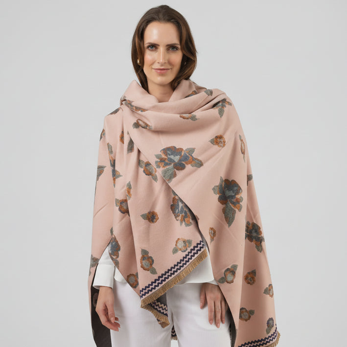 Woman wearing a pink floral patterned scarf on a white background