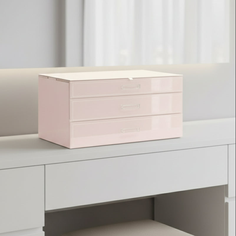 Pink jewelry box with two drawers on a white background