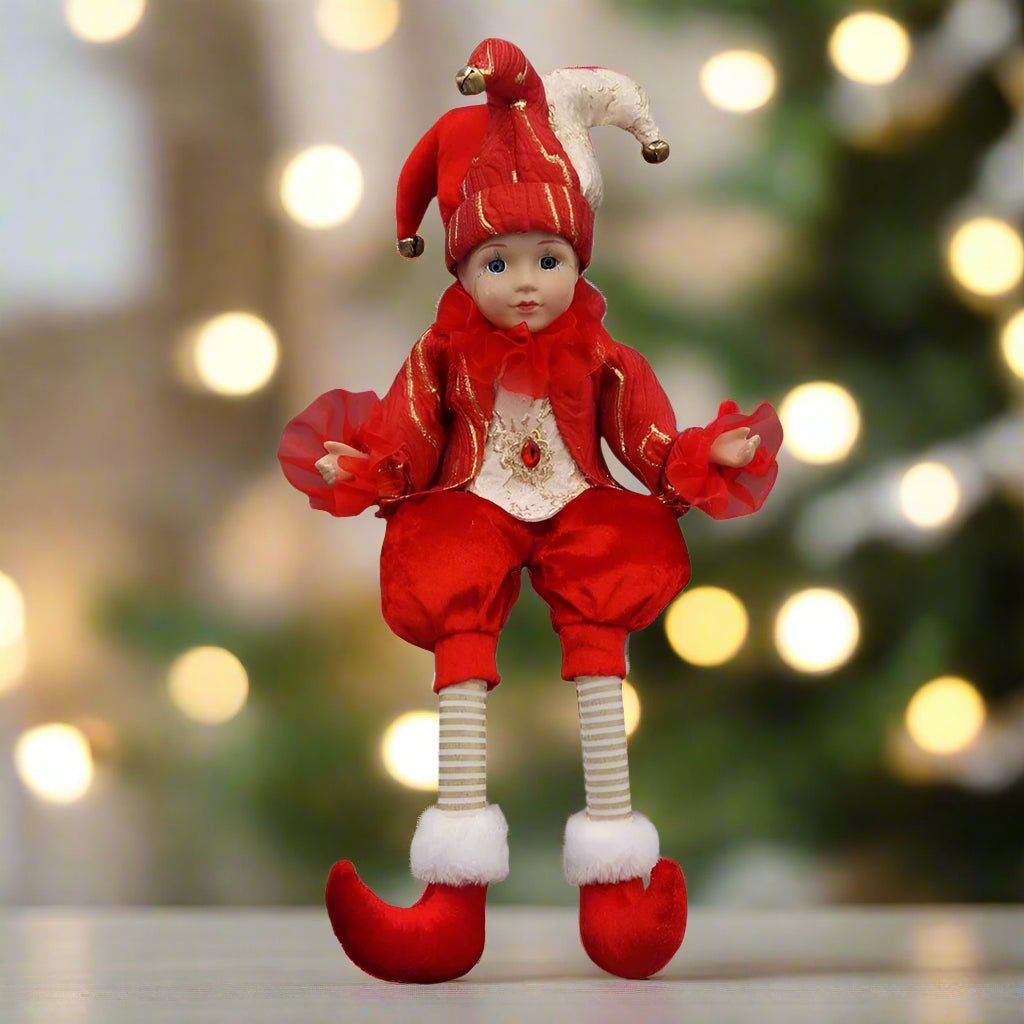 Red clown doll with a white hat on a white background