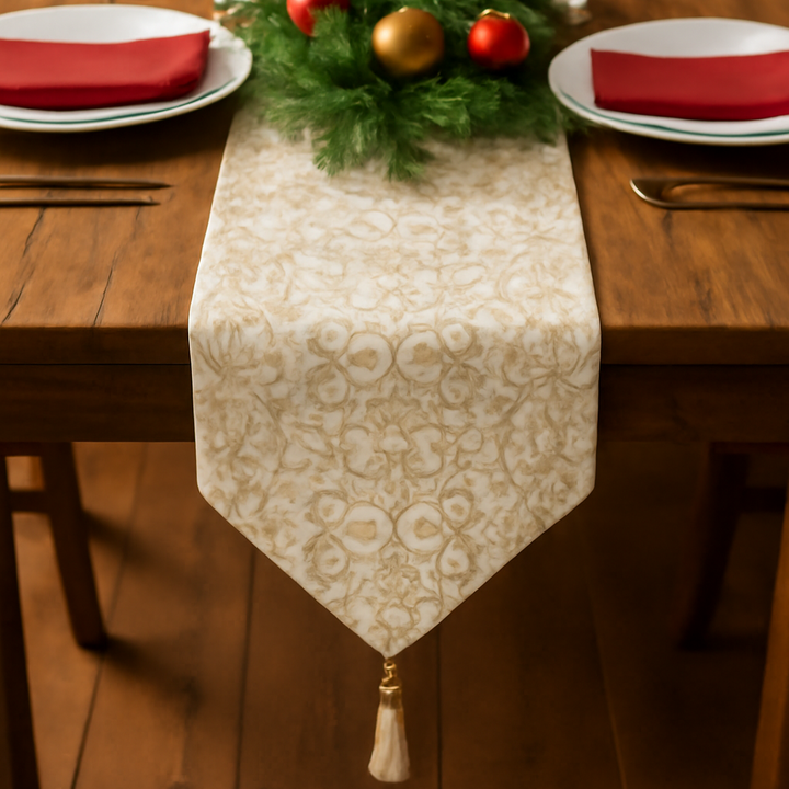 Decorated Christmas table with a table runner, candles, and ornaments.