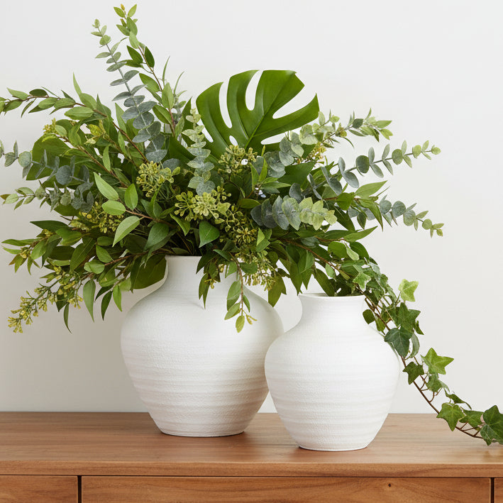 Two white vases on a white background