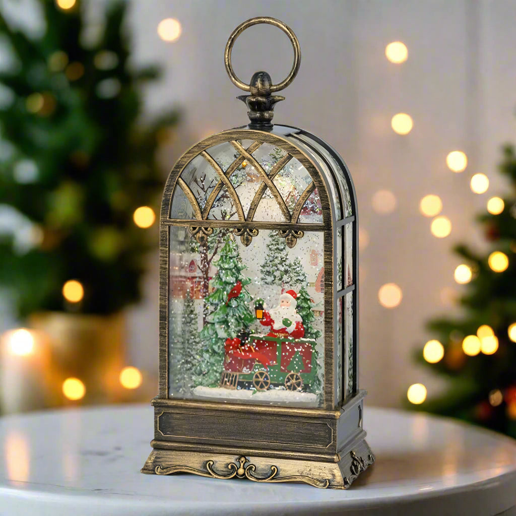 Decorative Christmas scene with Santa Claus in a glass dome on a white background
