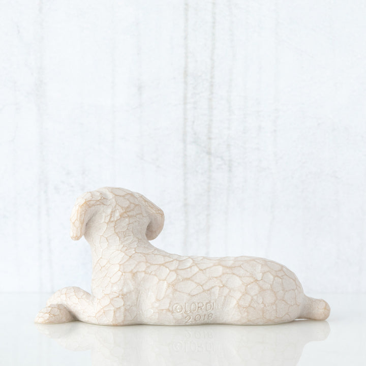 SMALL LYING WHITE DOG