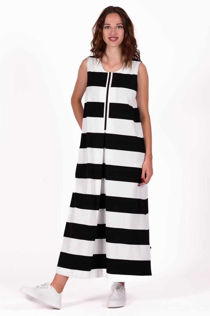 Woman wearing a black and white striped dress on a white background