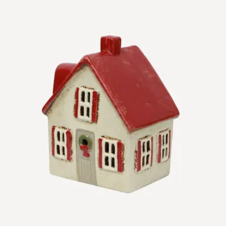 Small model of a house with a red roof on a white background