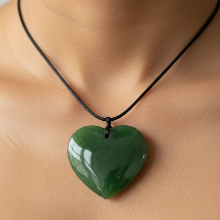 30MM GREENSTONE HEART necklace on persons neck